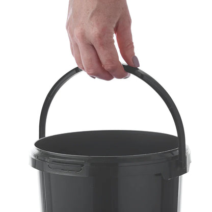 Black Bucket with a hand holding onto its handle on a white background