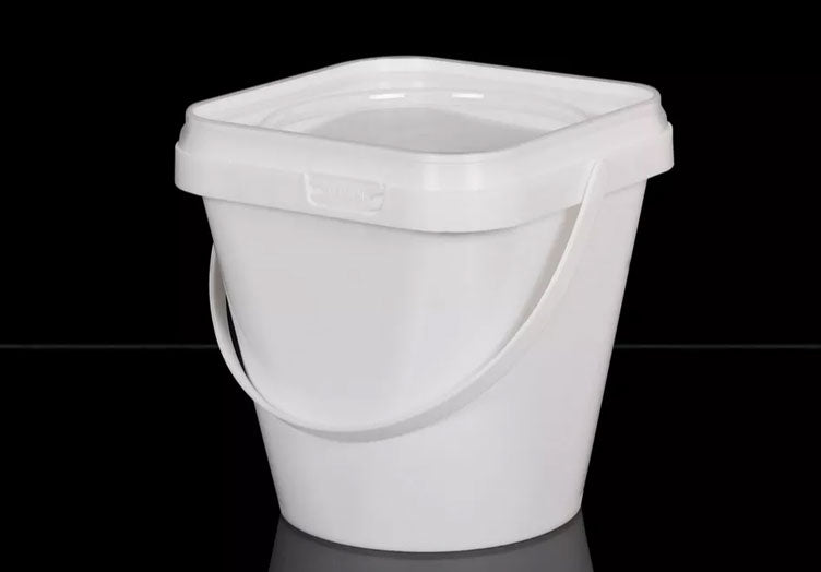 White plastic bucket on a black background